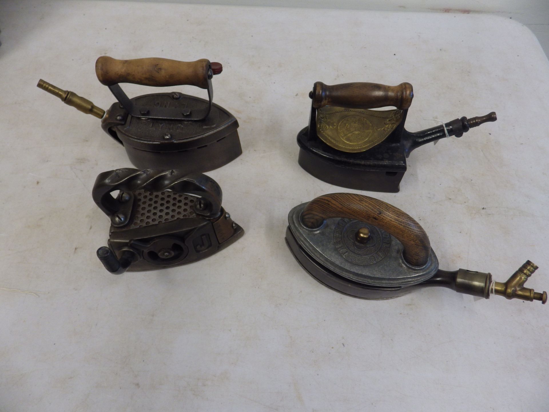 4 assorted gas irons to incl The Flower circa 1920's, Lyng rd 74378, The Premier and Beecrofts J