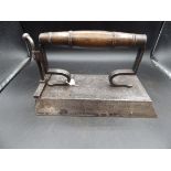 Billiard box iron with slug and wood handle, approx 31cm long on base