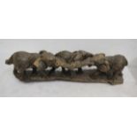 A wooden carved elephant family herd 53cmL