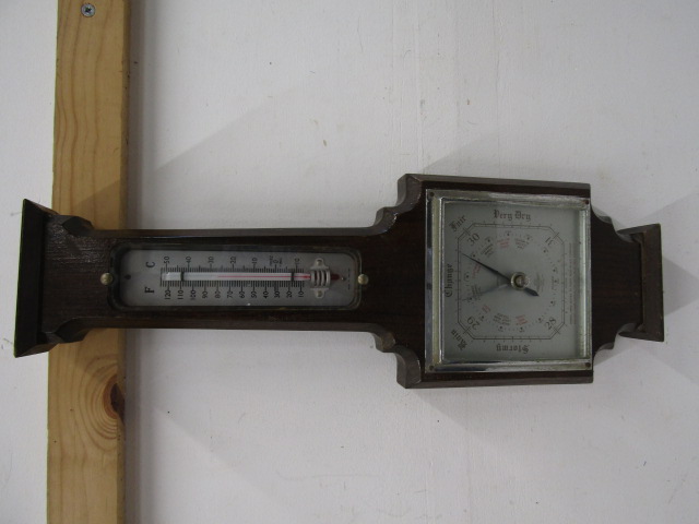 A square  barometer in oak case