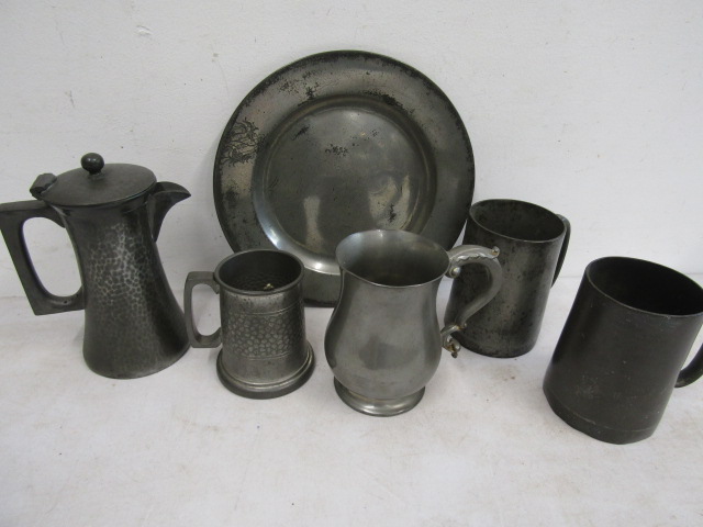 Old pewter tankards and dish