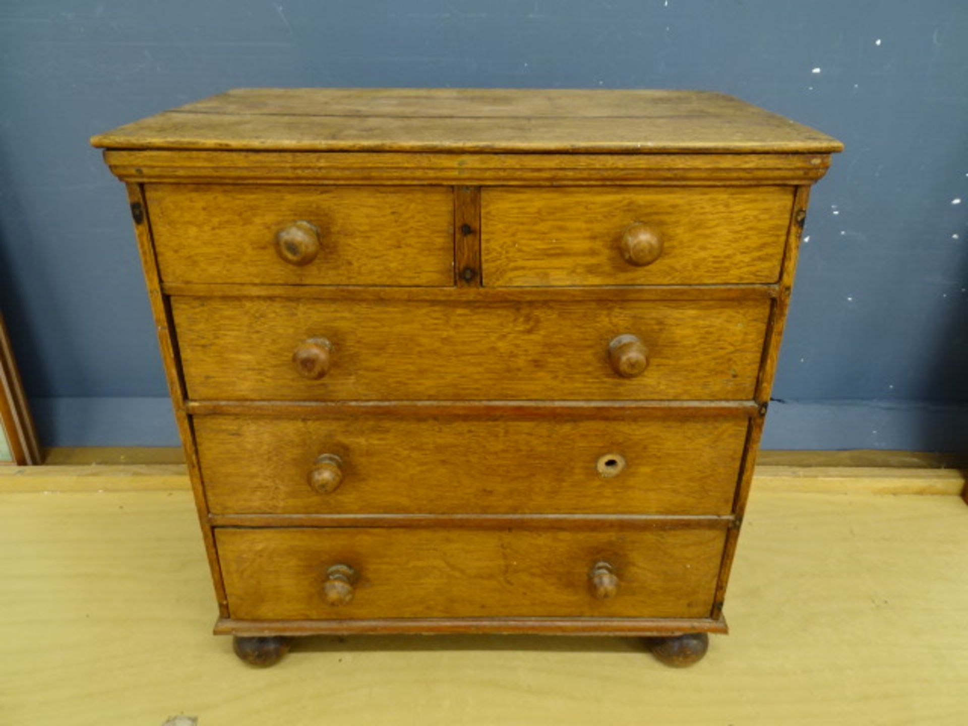 Miniature oak 2 short over 3 long chest of drawers (missing one knob) H44cm W42cm D29cm approx