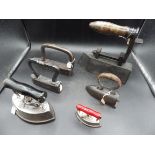 6 assorted irons to include tailor goose irons incl one old hand forged iron, box iron with slug and