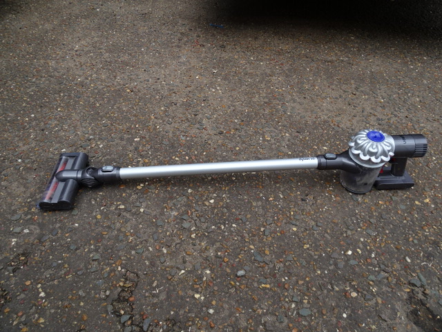 Dyson V6 cordless vacuum cleaner with charger from a house clearance