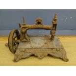 Antique sewing machine with ornate cast iron base