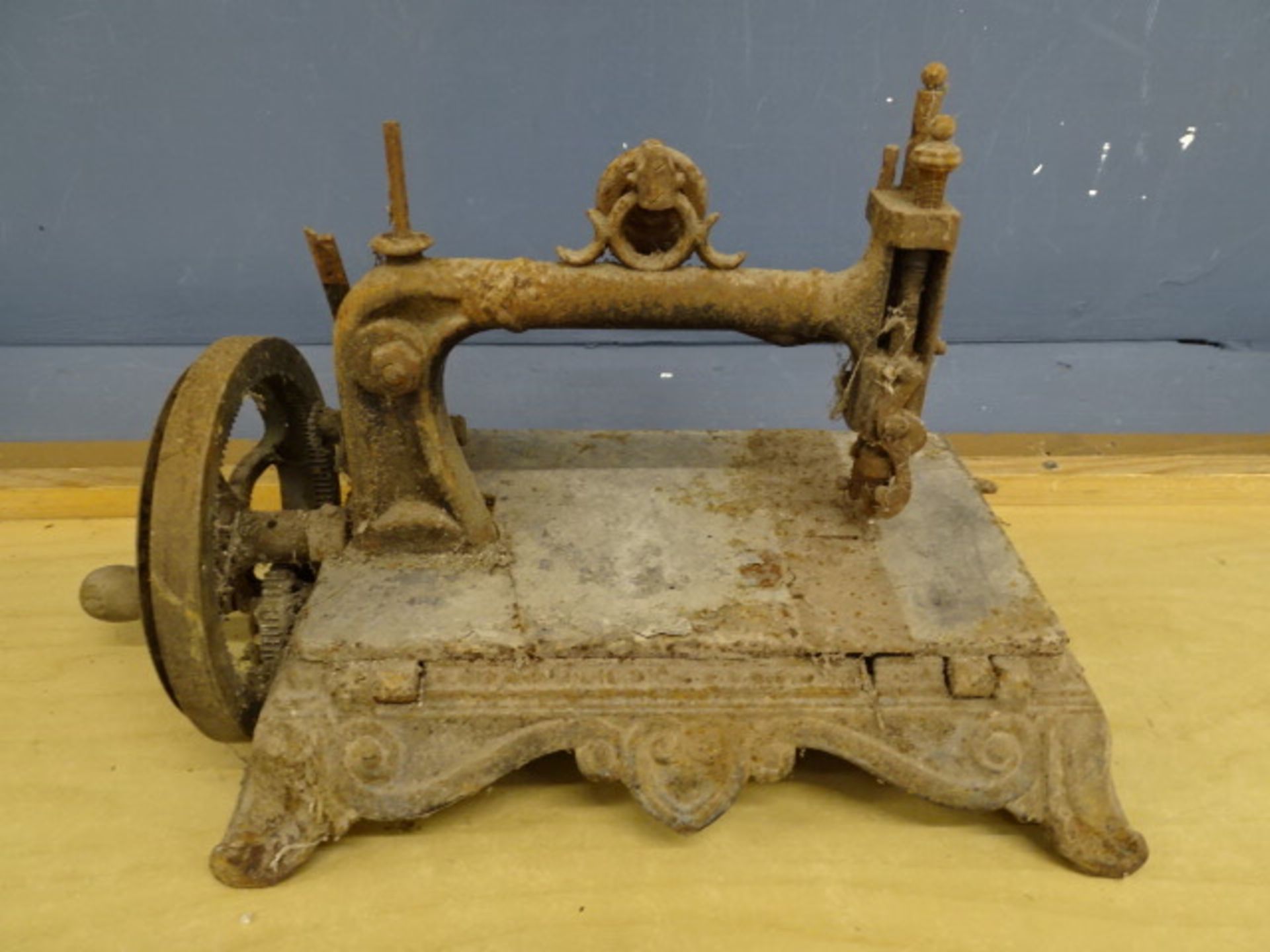 Antique sewing machine with ornate cast iron base