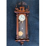 GUSTAV BECKER; a late 19th century rosewood and walnut cased Vienna type wall clock, the enamel dial
