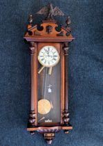 GUSTAV BECKER; a late 19th century rosewood and walnut cased Vienna type wall clock, the enamel dial
