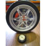 mini John Deere tyre clock and a larger tyre clock