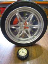 mini John Deere tyre clock and a larger tyre clock