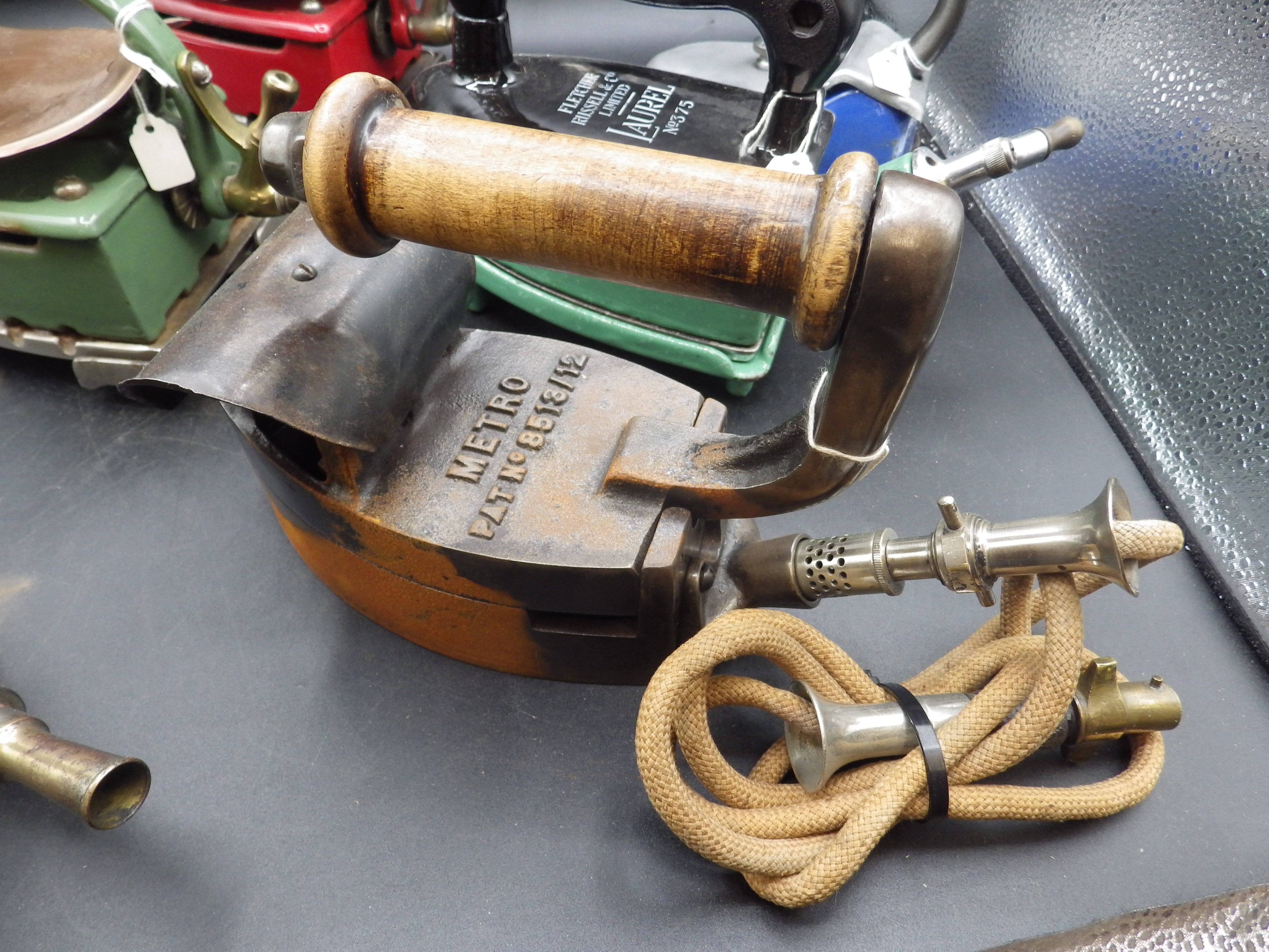 3 Fletcher Russel & Co enamel 'Laurel' gas irons, all with trivets and 2 with heat shields - Image 3 of 4