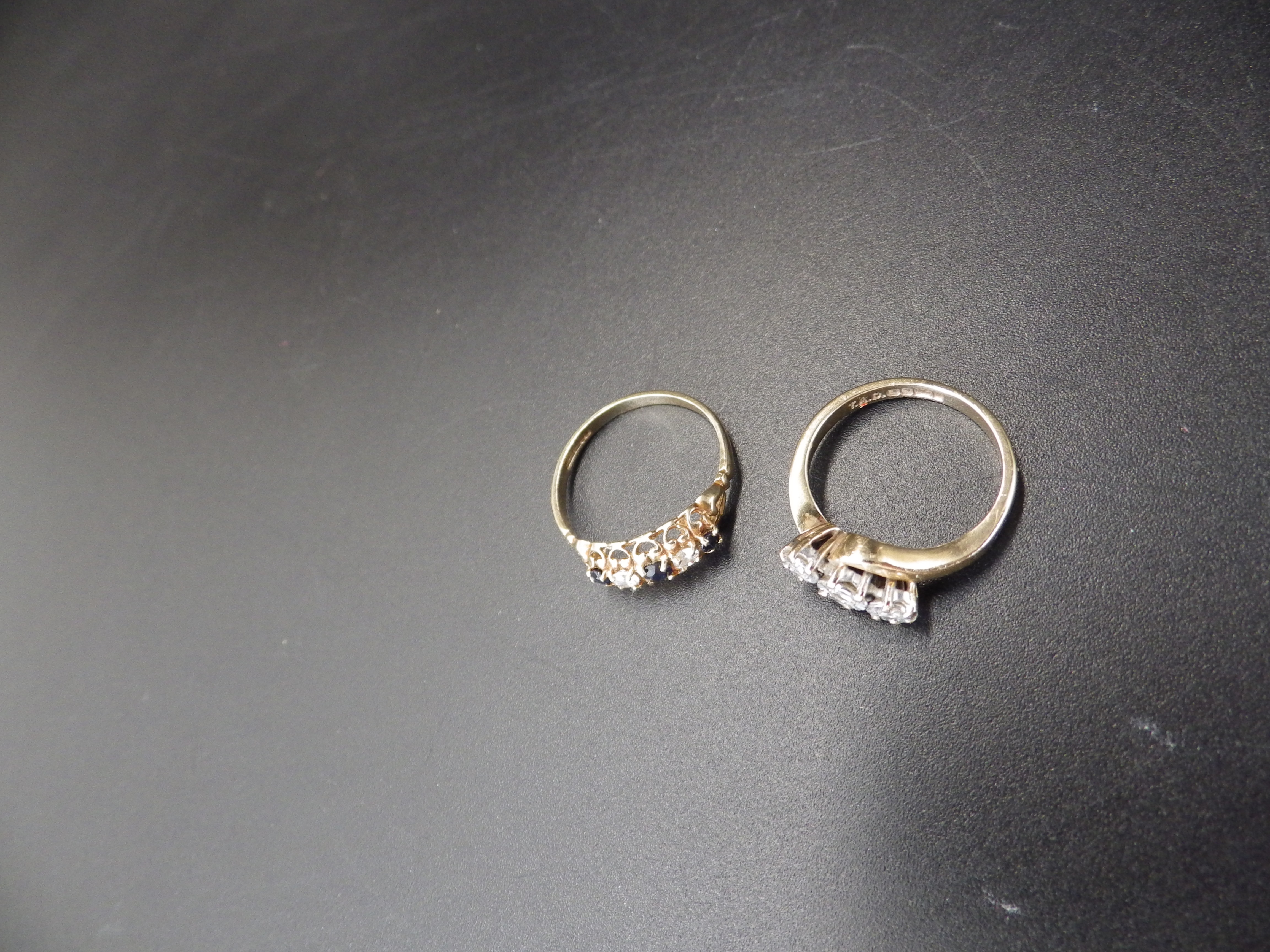 2, 9ct rings smallest size 'I' with 3 diamonds and one size 'M' with Cubic Zirconia and sapphire. - Image 2 of 2