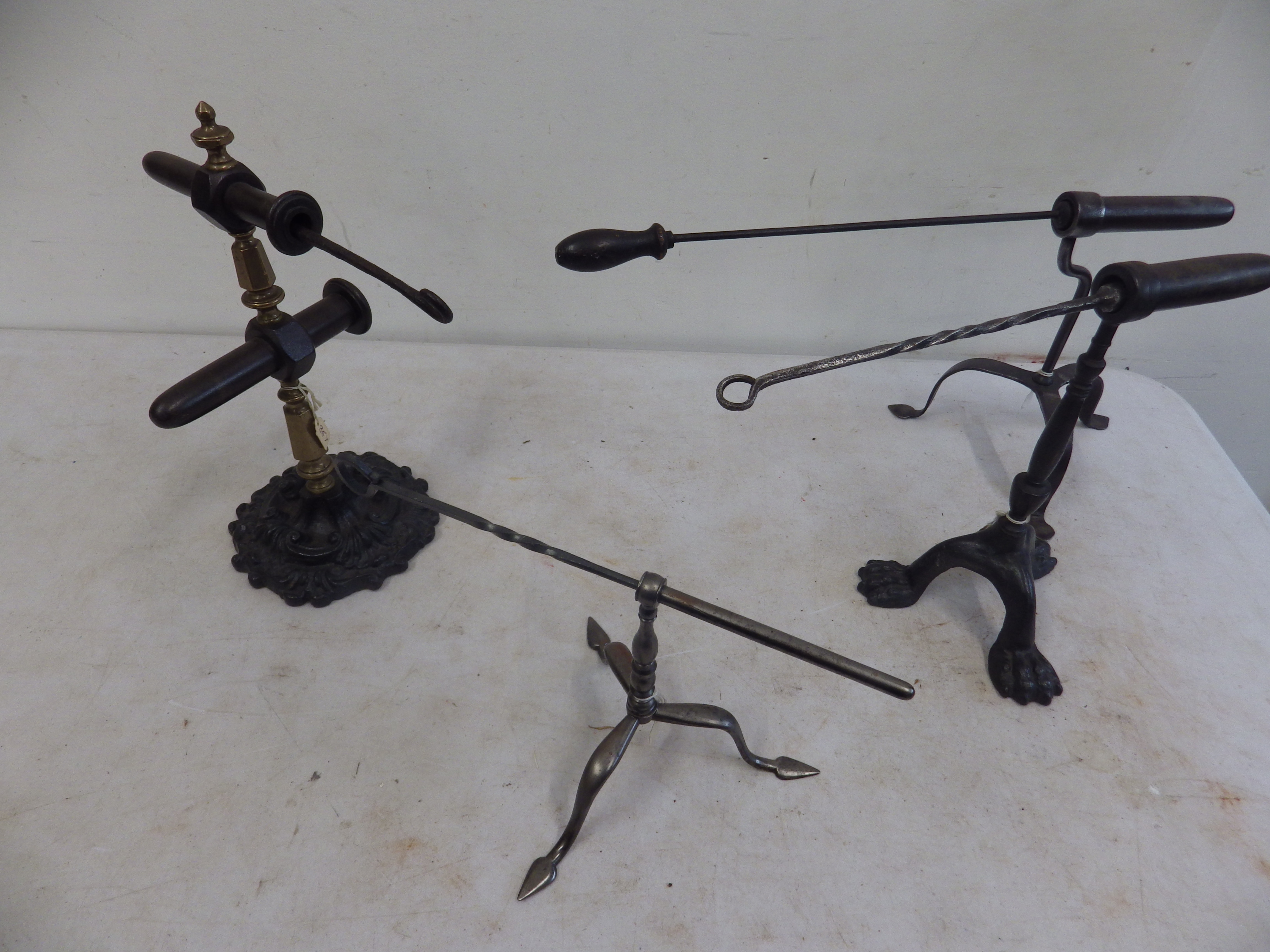 4 goffering irons - 3 with tripod stands and 1 french? with ornate stand and brass fittings