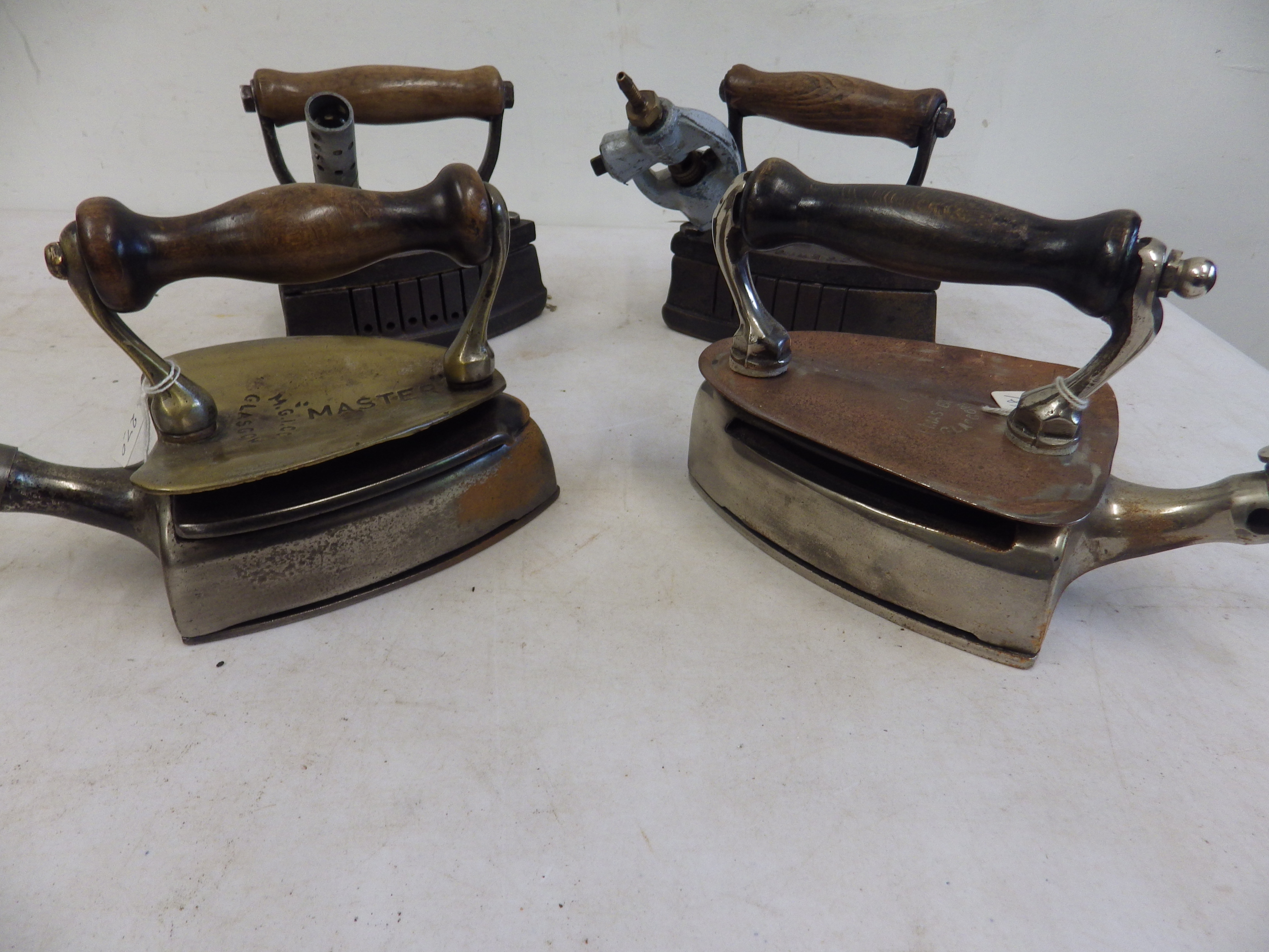 2 M G I Co Glasgow Master gas irons with copper/brass heat shields together with 2 Lister Bros No. - Image 2 of 6