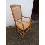 Wooden armchair with cane seat and back