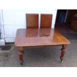 Mahogany wind out extending dining table with winder (one castor is broken as shown in pictures)