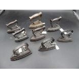 8 miniature flat irons to incl J & J Siddons No. 1 No.2, No. 3, No.4 & No.5 plus Cross No. 0 , No. 1