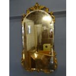 Bevelled wall mirror with ornate gilt detail 43cm x 85cm approx