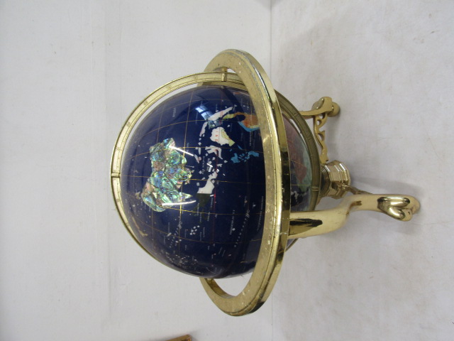 A semi-precious stone globe in stand