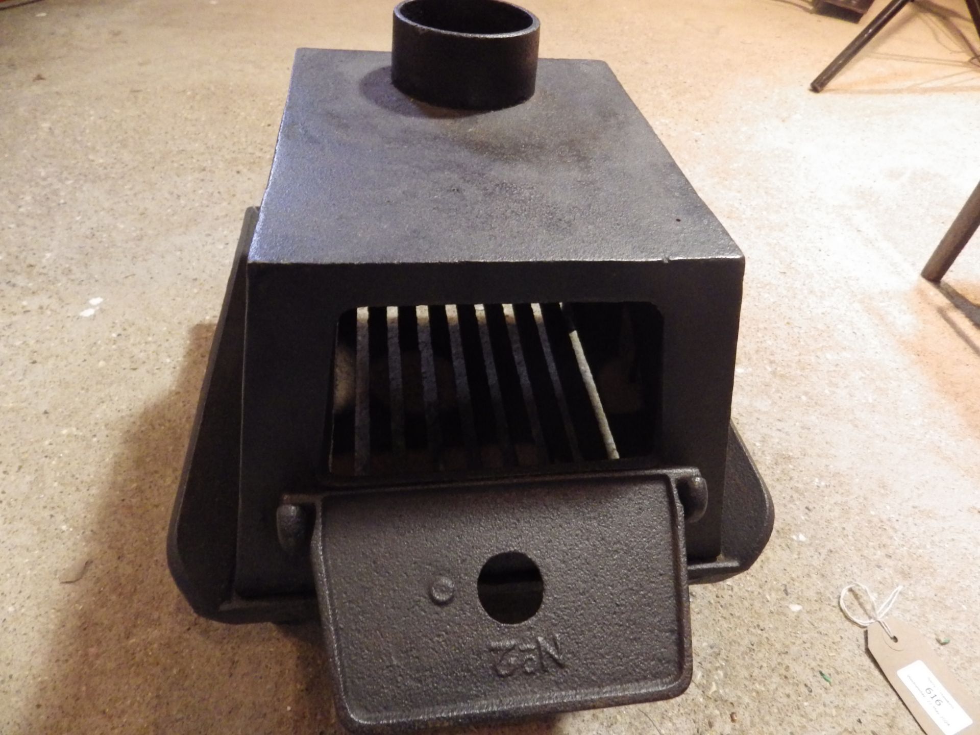 No.2 Squat cast iron stove with grate and hinged door and chimney flue stand rest for 3 irons - Image 2 of 4