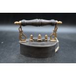 Scottish teardrop shaped box iron with brass castings and brass scroll posts with wood turned handle