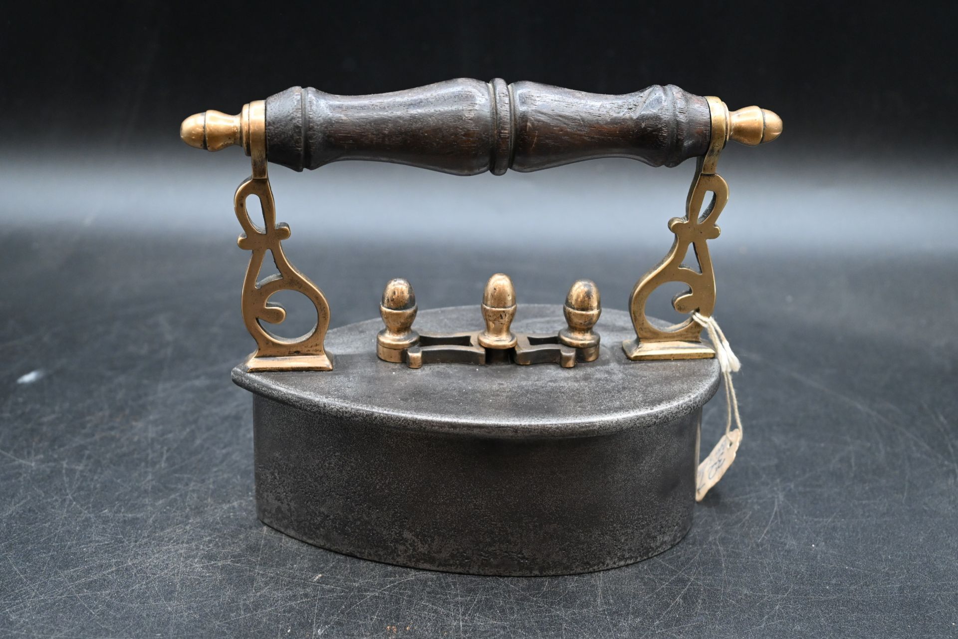 Scottish teardrop shaped box iron with brass castings and brass scroll posts with wood turned handle