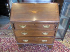 An Edwardian mahogany inlaid bureau