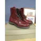 A pair red boots size 5