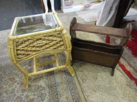 A wicker side table and a wooden magazine rack