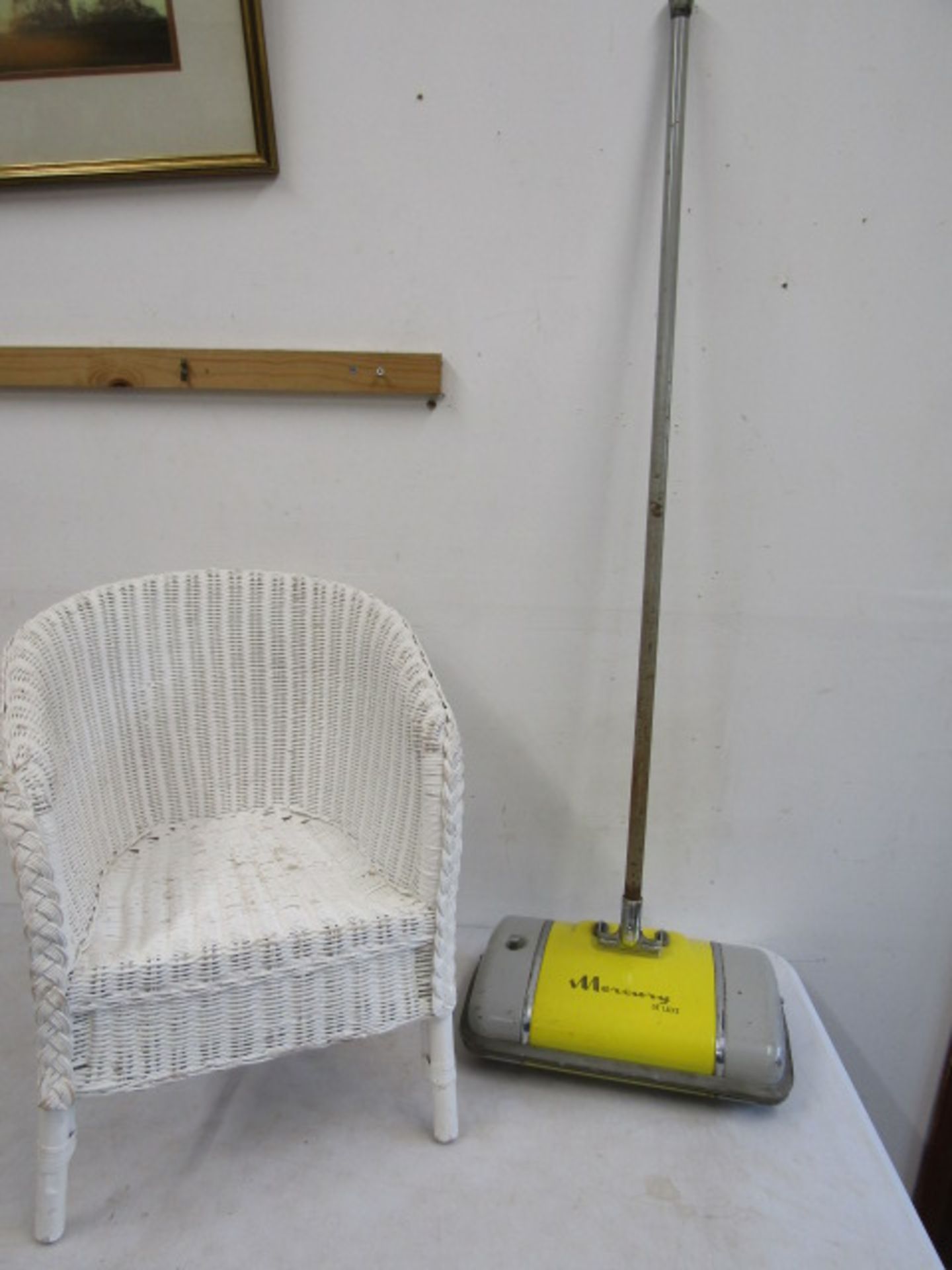 child's wicker chair and a Mercury carpet sweeper