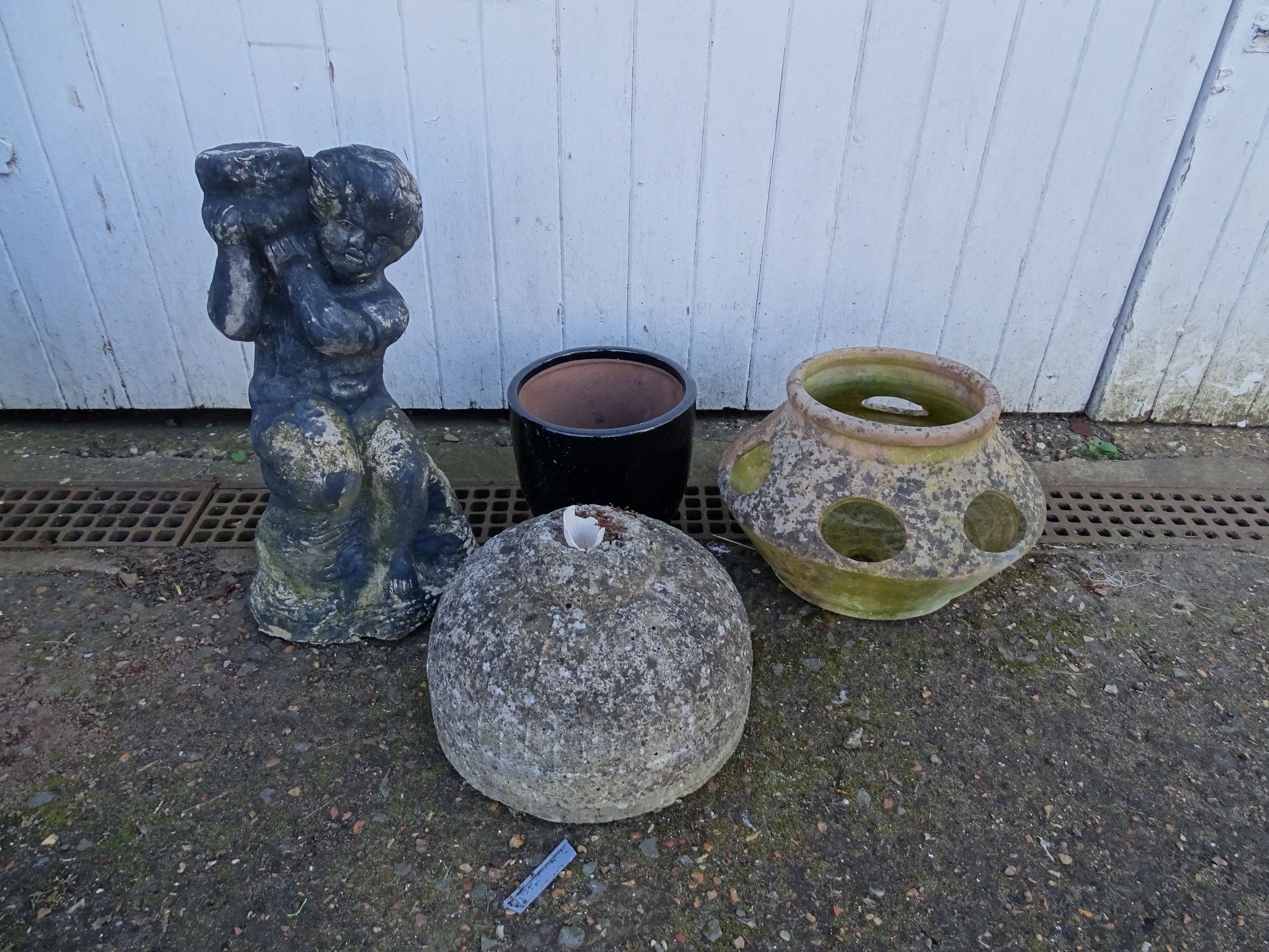 Garden pots, statue and concrete parasol base