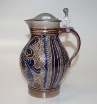 Stoneware jug with pewter lid