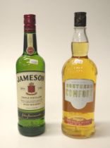 Two various unopened bottles spirits