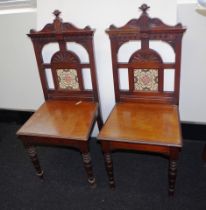 Pair Edwardian tile back hall chairs