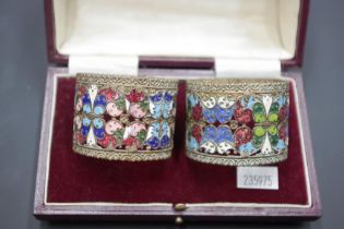 Two Chinese enamel & metal pierced napkin rings