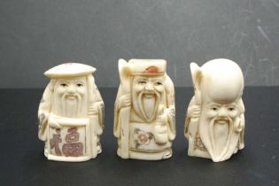 Three Japanese carved bone sage netsukes