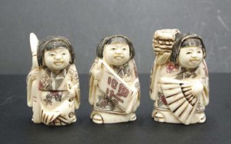 Three Japanese carved bone young girl netsukes