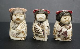 Three Japanese carved bone young girl netsukes