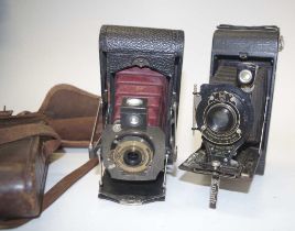 Two antique folding bellows cameras