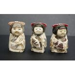 Three Japanese carved bone young girl netsukes