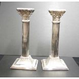 Pair Corinthian column form plated candlesticks