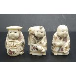 Three Japanese carved bone young men netsukes