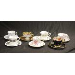 Seven various decorated coffee cups & saucers