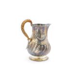 George III silver rococo milk jug