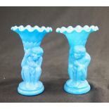 Two blue glass monkey spill vases