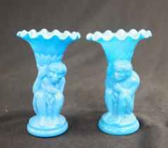 Two blue glass monkey spill vases