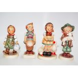 Four early Goebel Hummel girl and boy figures