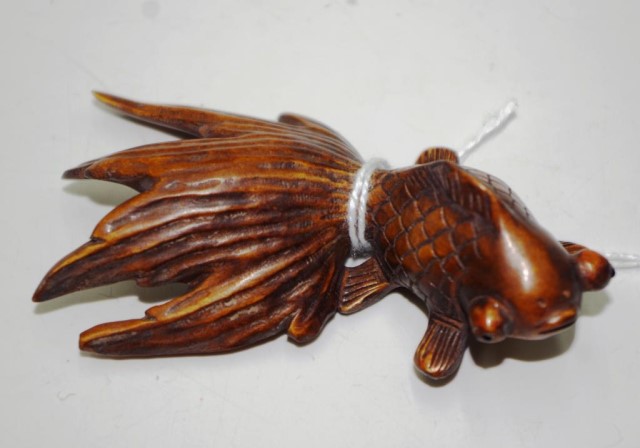 Japanese carved boxwood fighting fish netsuke