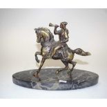 Bronzed figure of a man on horseback