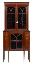 An Edwardian mahogany and glazed serpentine-front display cabinet,
